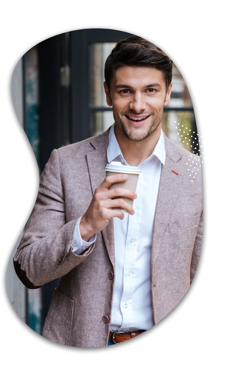 business man in pink tweed blazer drinks coffee considers workload automation job scheduling alternatives with rmt robert mark technologies